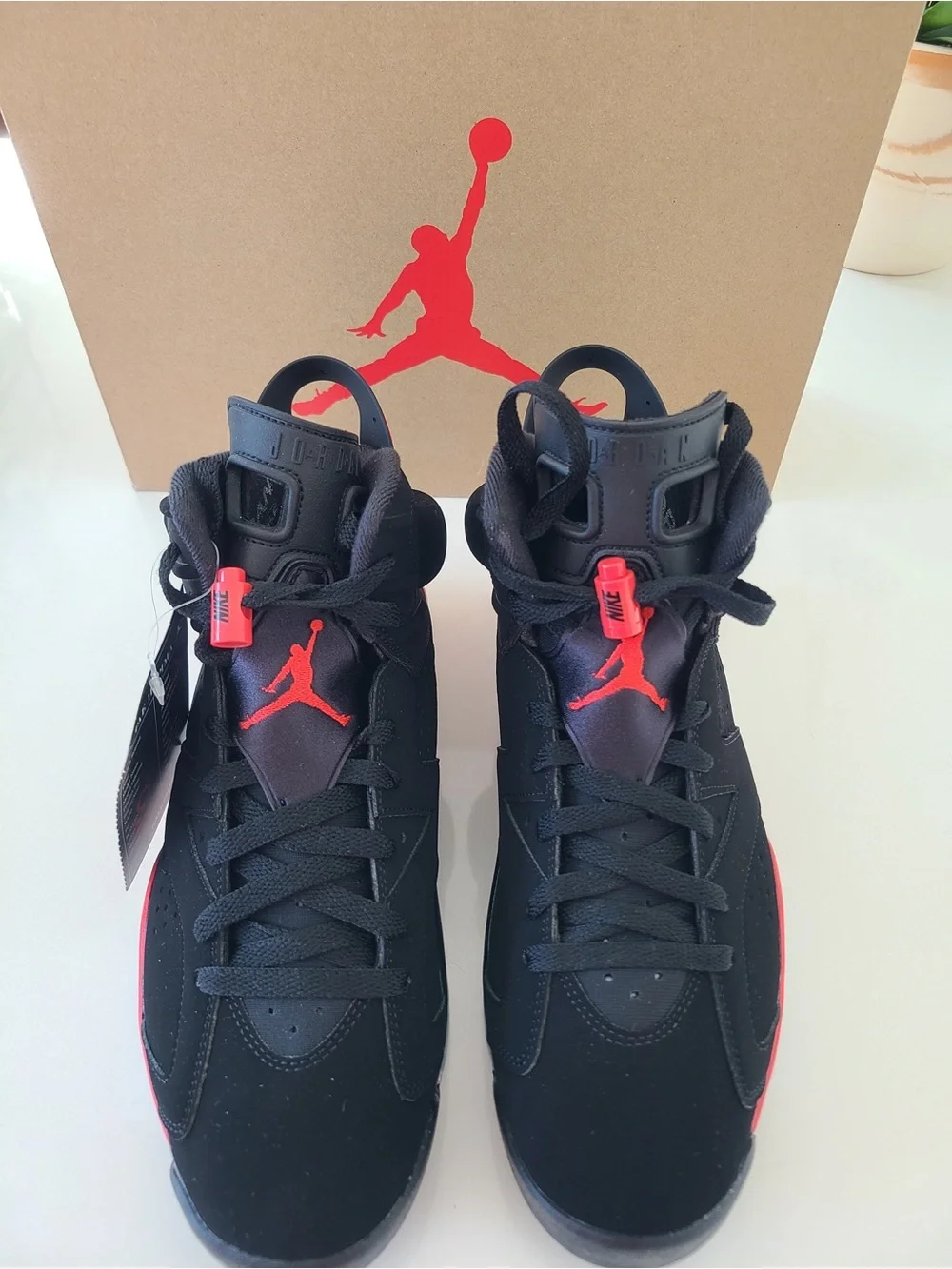 Jordan Kids Black Sneakers with Red Pull Tabs and Multicolor Tongue